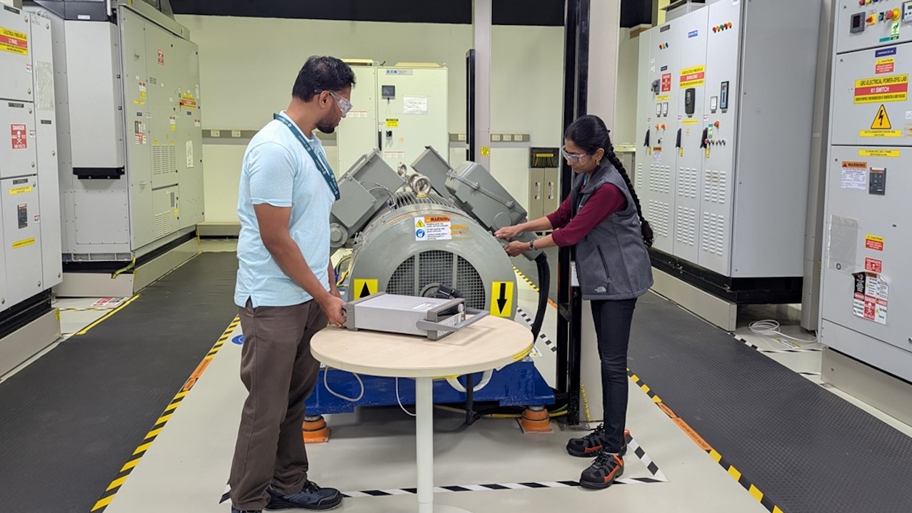 Veena P. and teammate in lab